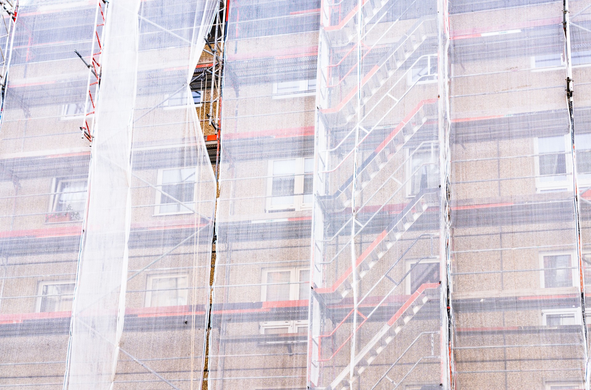 Scaffolding and safety netting on apartment building during renovation